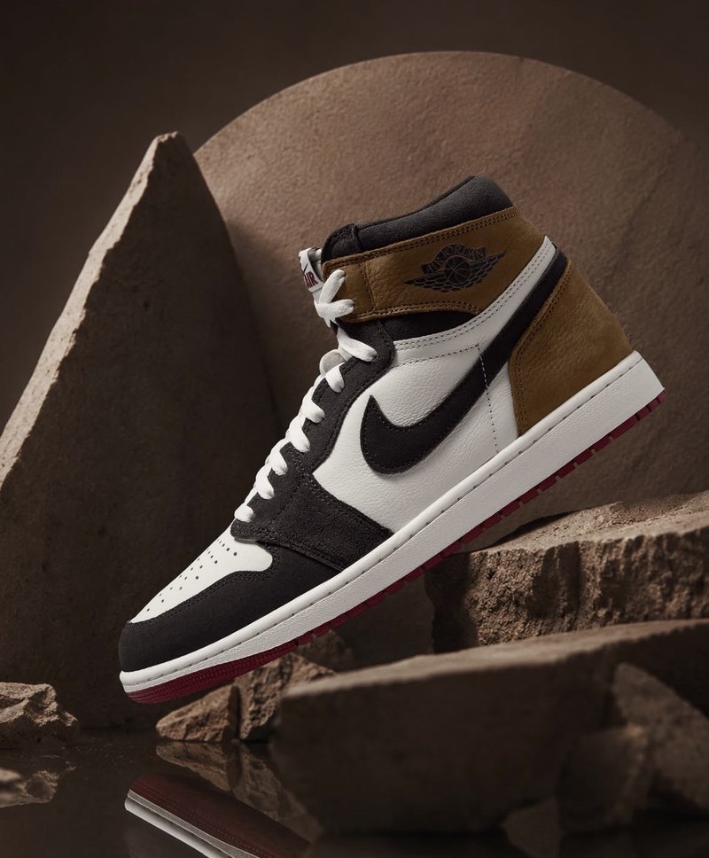 Two sneakers in protective storage boxes on a shelf representing a deliberate hold strategy for resale timing