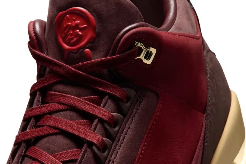 Numbered limited-edition sneaker box with dust bag and cedar shoe tree shown in flat-lay, illustrating BIN 23 premium packaging contents
