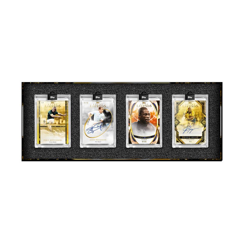 Premium rugby trading card in clear protective case resting on a grass rugby pitch surface in natural daylight