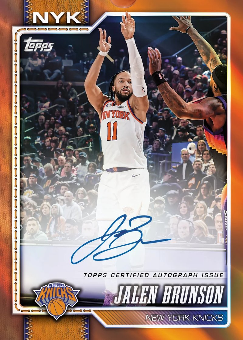 Glossy basketball trading cards fanned out on a dark surface showing foil inserts from a 2026-27 hobby box, illustrating the types of cards collectors and resellers chase