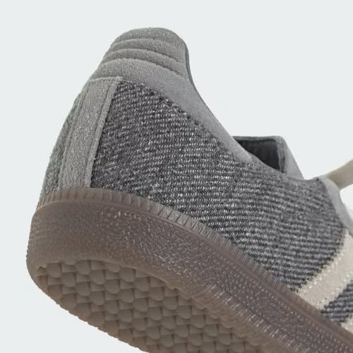 Flat-lay of two colourways of grey and mint low-top trainers alongside paper receipts representing the Matcha and Slate Samba collabs