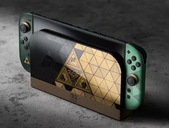 Close-up of a gold-toned limited-edition gaming console with embossed design detail on dark matte surface